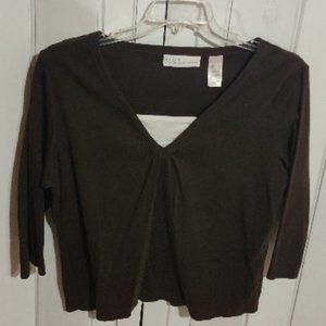 A sweater like brown and white blouse.